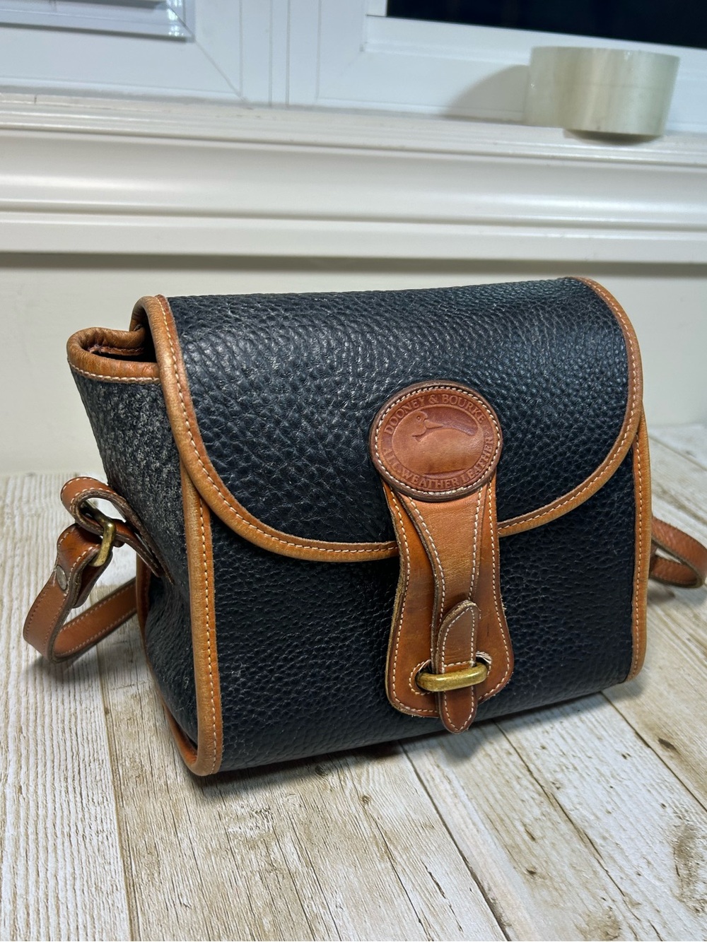 Dooney & Bourke Black Pebbled Leather Crossbody Bag with Brown Trim